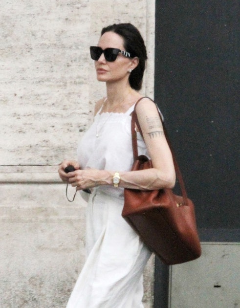 Angelina Jolie Gives A Rare Street Style Look In A White Wrap