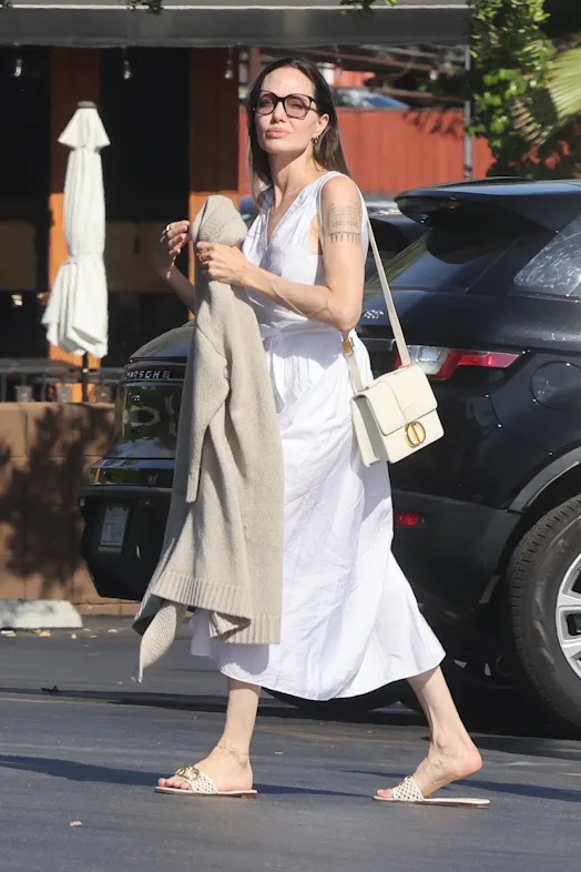 angelina jolie white dress Wearing Low Cut Standing Turned Arm Bent Head Tilted Down Looking Forward 8 X 10 Inch Photo at Amazon's Entertainment Collectibles Store angelina jolie white dress Braves