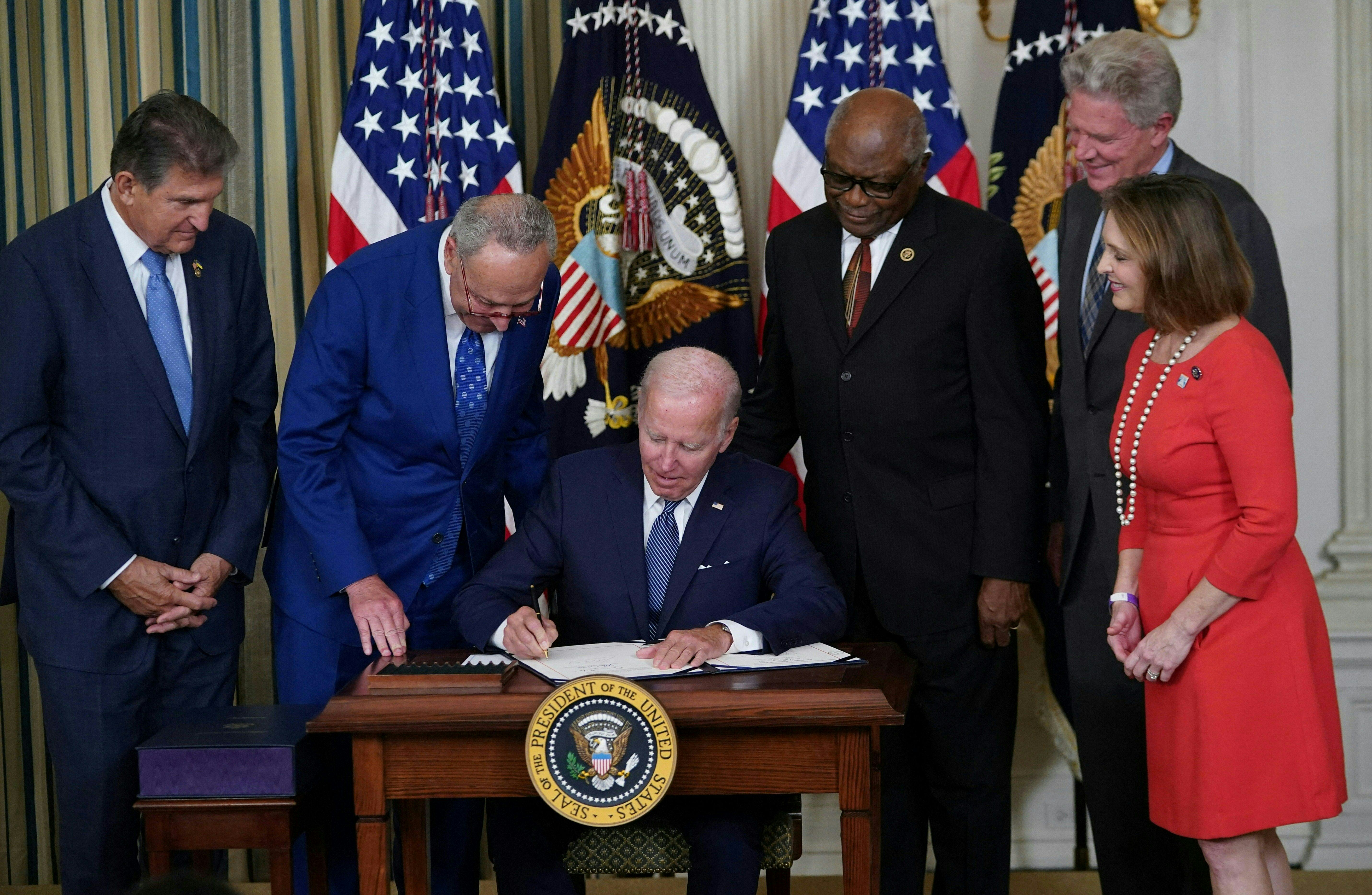  President Joe Biden signs the Inflation Reduction Act of 2022 into law during a ceremony in the Sta...