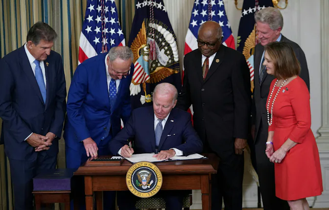 President Joe Biden signs the Inflation Reduction Act of 2022 into law during a ceremony in the Sta...