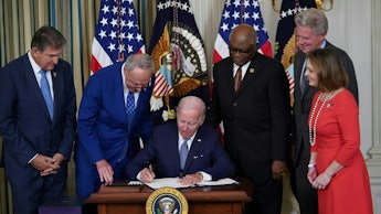  President Joe Biden signs the Inflation Reduction Act of 2022 into law during a ceremony in the Sta...