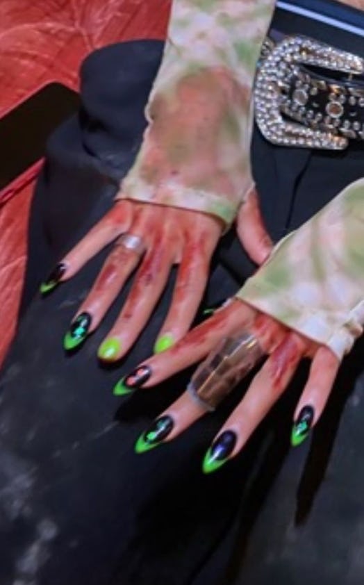 Amandla Stenberg's 'Bodies Bodies Bodies' nails, black and green manicure.