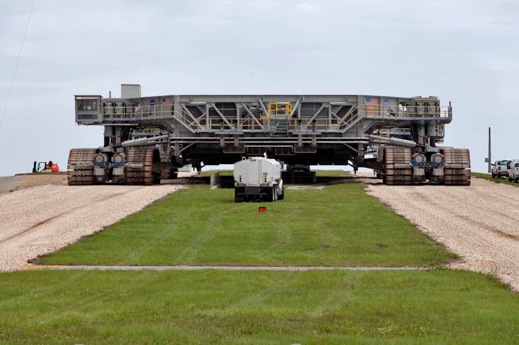 A giant tracked vehicle. It isn't carrying anything and it looks like a large empty platform, except...