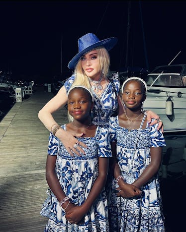 Inside Madonna's 64th Birthday Celebrations in Italy 3 Madonna matching with two of her children in blue-and-white dresses by Dolce & Gabbana