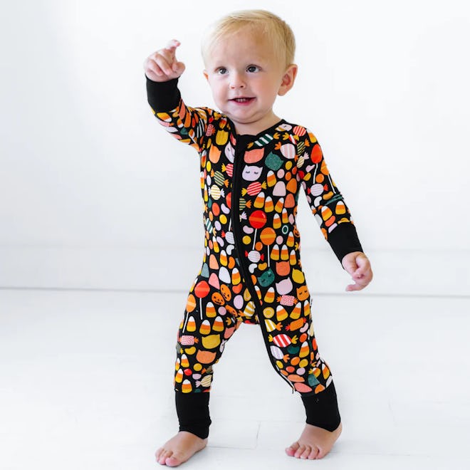 Baby Halloween pajamas covered in candy are extra sweet.