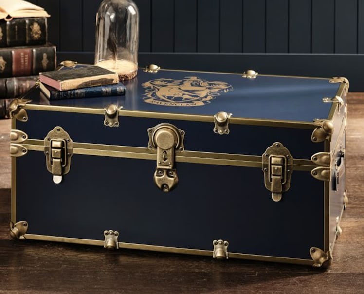 The House Crest Trunk is a magical dorm decor piece from Pottery Barn Teen's Harry Potter home colle...