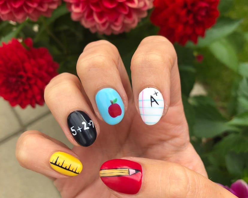 back to school nails with nail art on each finger