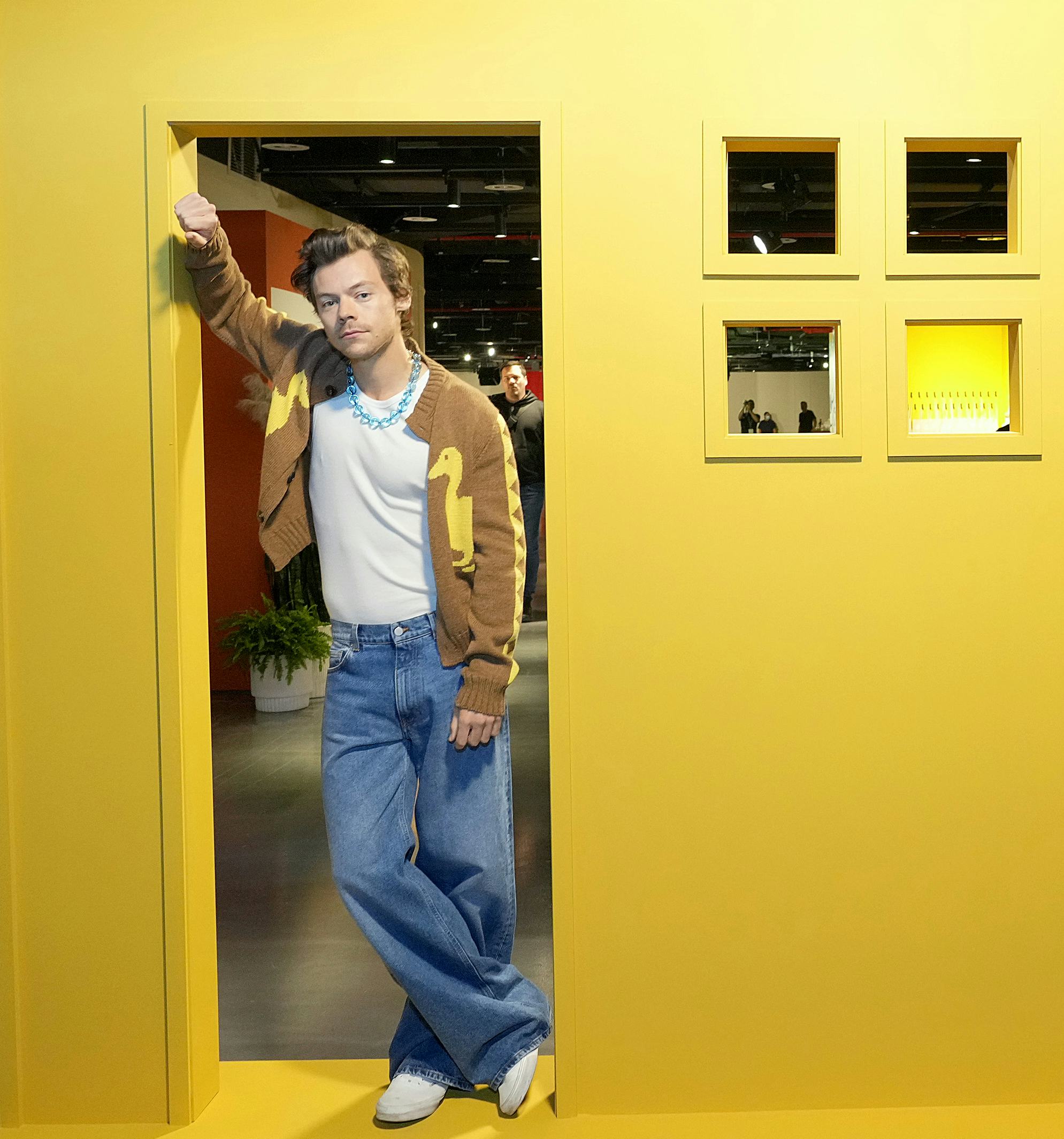 Harry Styles in a yellow house cutout, ahead of his 'Harry's Housewarming' Party in NYC, as part of ...