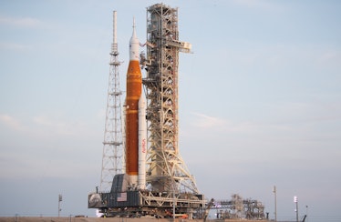 The massive Space Launch System rocket sits atop the launch pad at Kennedy Space Center. 