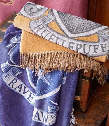 The Chenille Crest Throw is a magical dorm decor piece from Pottery Barn Teen's Harry Potter home co...