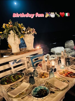 A scene from Madonna's 64th birthday dinner in Italy