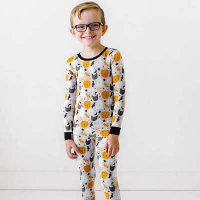 Classic orange and black Halloween pajamas for kids are perfect for pics and movie nights.