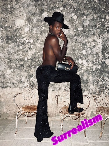 A shirtless David Banda at Madonna's Surrealism-themed 64th birthday party