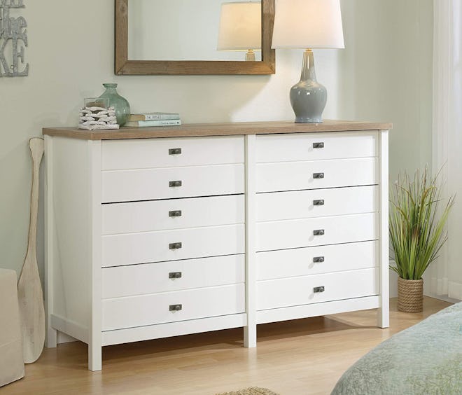 With appealing farmhouse vibes, the Sauder Cottage Road Dresser is one of the best dressers for coup...