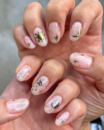 Female hands with moon nail design