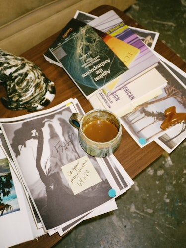 Emma's references and books atop a table in her studio.