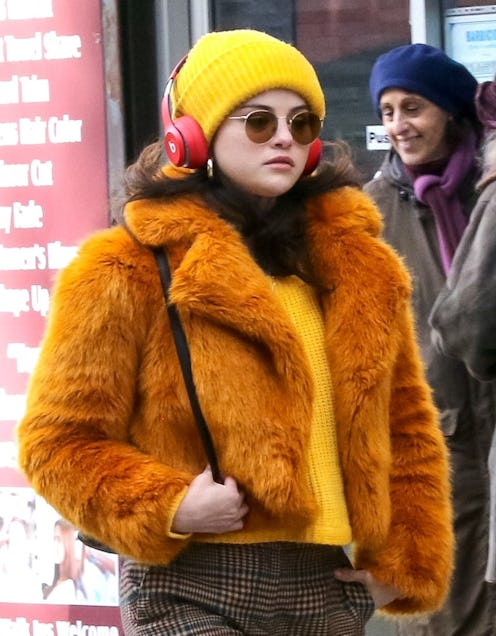 selena gomez wearing a marigold outfit on the set of 'only murders in the building'
