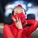 Jennie wearing bright red Alaïa that obscures her mouth in Blackpink's 'Pink Venom' music video