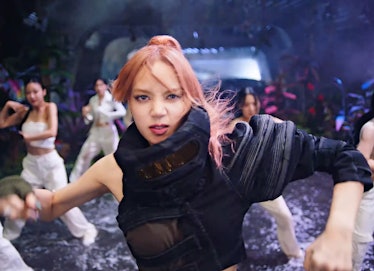 Lisa in a one-sleeved black top in Blackpink's 'Pink Venom' music video
