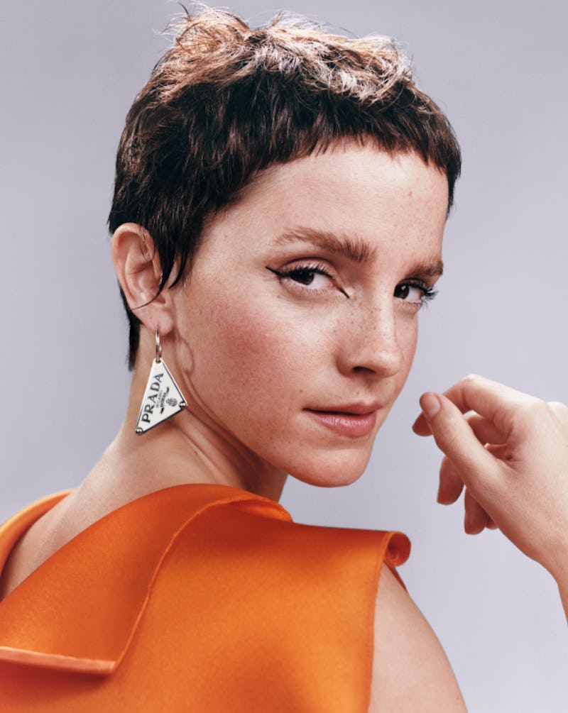 Emma Watson debuted a pixie haircut with baby bangs in a new advertisement for Prada Beauty's upcomi...