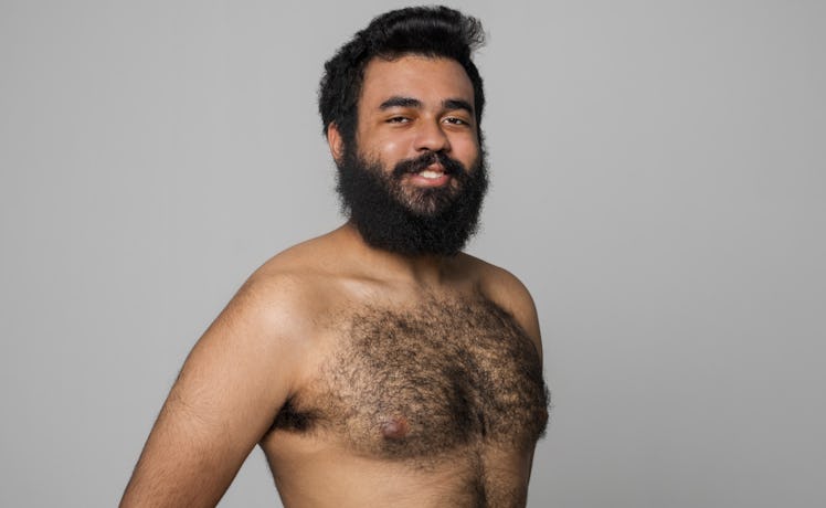 A man with a lot of body hair posing for a photo