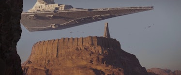 A Star Destroyer hovers over Jedha City in Rogue One: A Star Wars Story