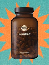 Postpartum hair-loss remedies: bottle of Moon Juice SuperHair supplement for hair loss containing 12...