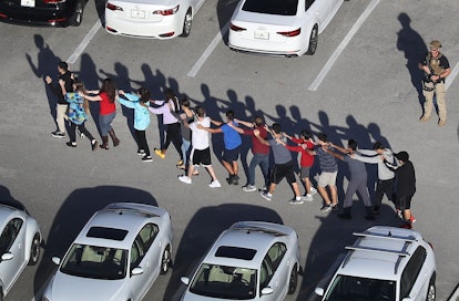 Students brought out of the Marjory Stoneman Douglas High School after a shooting