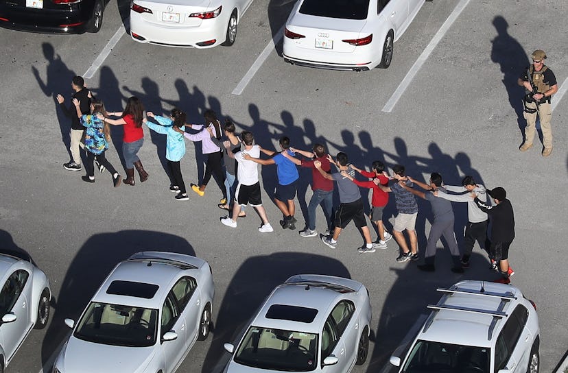 Students brought out of the Marjory Stoneman Douglas High School after a shooting