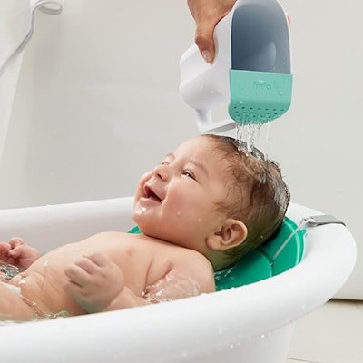 Rinsing baby's hair can stress them out, but a controlled flow rinser can do it gently.