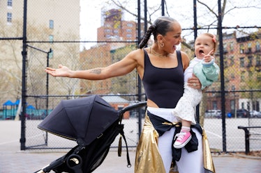 Robin Arzón holding her daughter, tips from peloton instructor