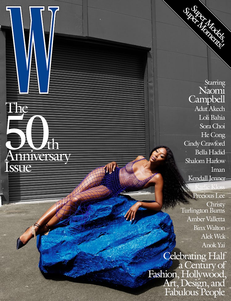 Naomi Campbell in a blue fishnet dress on the cover of W Magazine's 50th anniversary issue