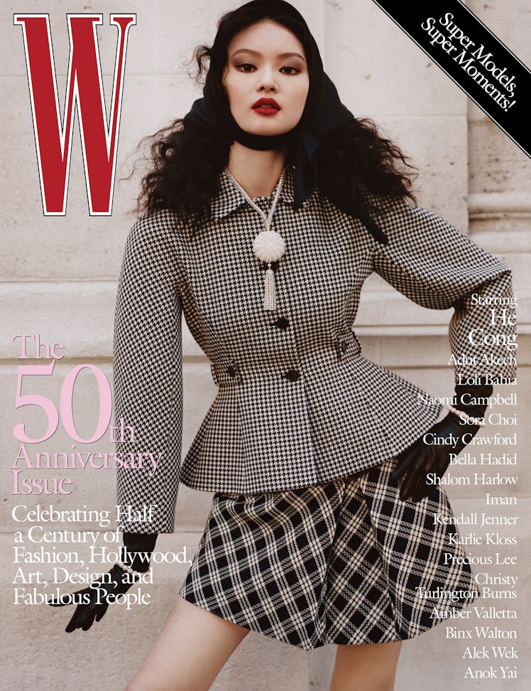 He Cong in a checkered coat and skirt with black gloves on the cover of W Magazine's 50th anniversar...