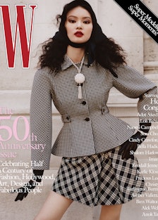 He Cong wears a Dior jacket and skirt; Boucheron necklace with detachable bracelets; stylist’s own g...