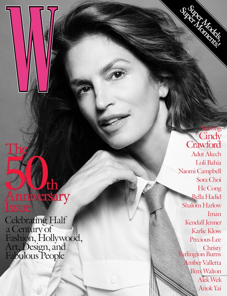 Cindy Crawford posing in a Louis Vuitton shirt and tie