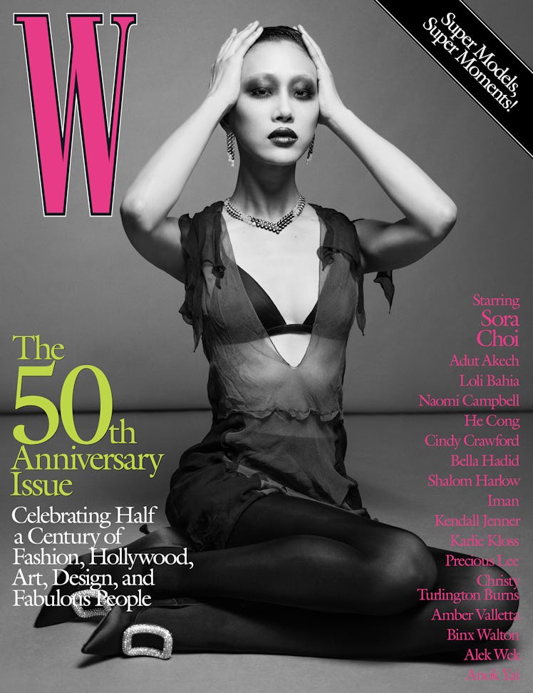 Sora Choi in a black dress, bra, and thights on the cover of W Magazine's 50th anniversary issue