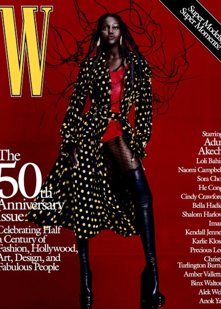 Adut Akech in a Burberry trenchcoat, corset top, fishnets, and boots on the cover of W Magazine's 50...