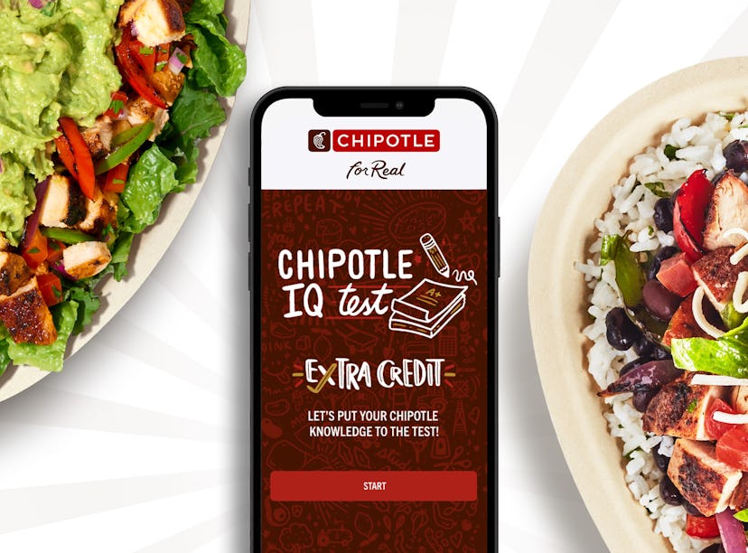 iPhone on a dining table with the Chipotle app opened, in the middle of two Chipotle dishes.