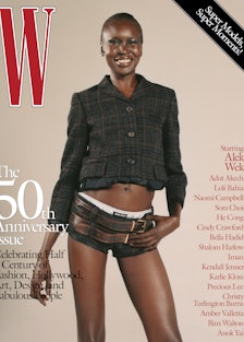 Alek Wek wearing a Miu Miu jacket, shorts, briefs, and belts