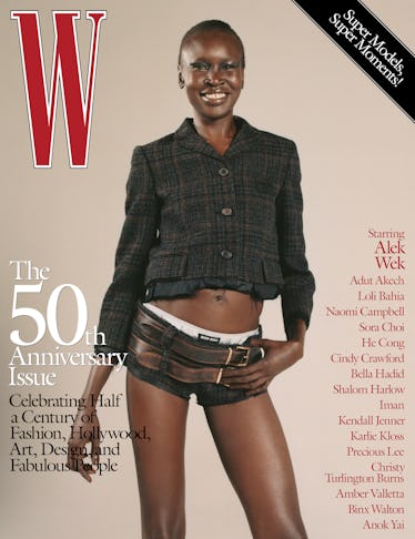 Alek Wek wearing a Miu Miu jacket, shorts, briefs, and belts