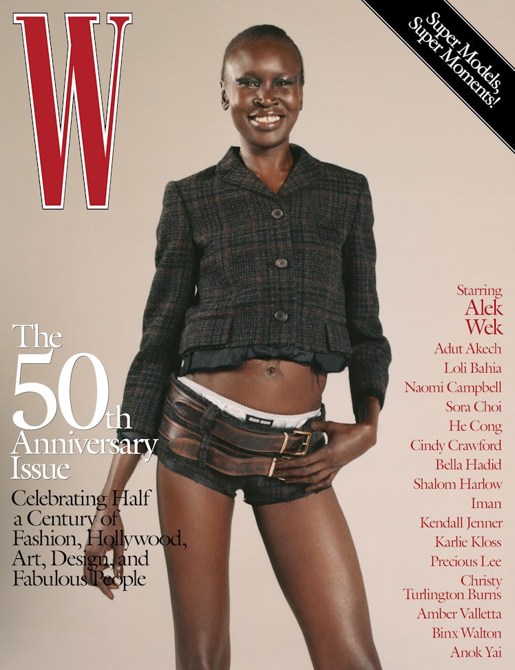 Alek Wek wearing a Miu Miu jacket, shorts, briefs, and belts