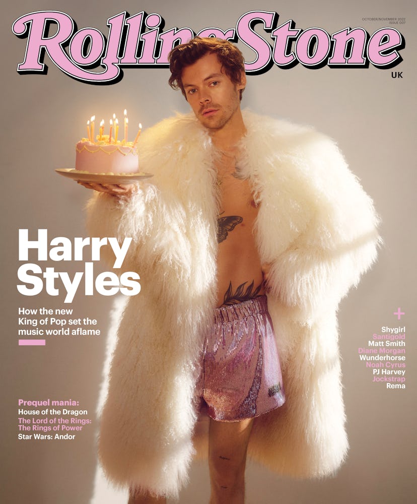 harry styles wearing a white fur coat and pink metallic shorts by JW Anderson on the UK cover of Rol...