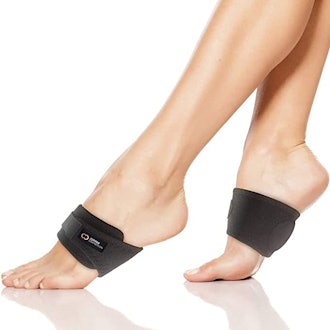 These padded arch support straps for foot pain are adjustable and fit under socks. 