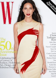 Christy Turlington Burnes in a beige and red dress on the cover of W Magazine's 50th anniversary iss...
