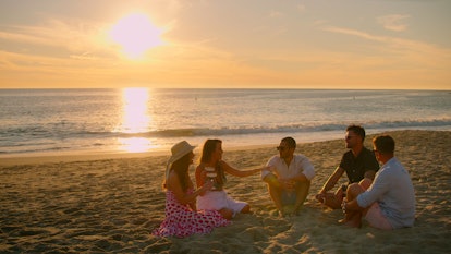 The Selling The OC cast gathers on the beach in Orange County