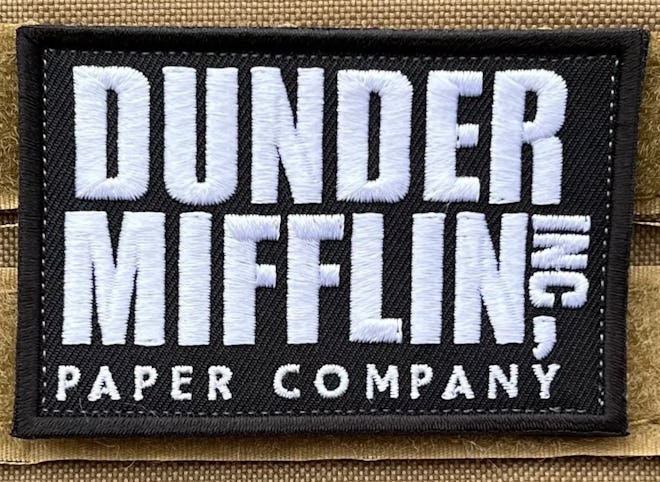 This Dunder-Mifflin iron-on patch is perfect for 'The Office' Halloween costumes.
