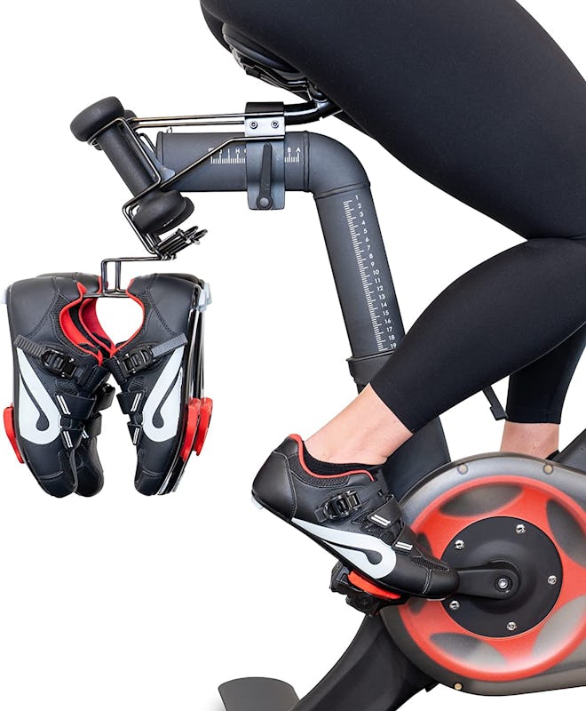 These convenient Peloton accessories clip onto the back of your bike to hold your extra shoes while ...