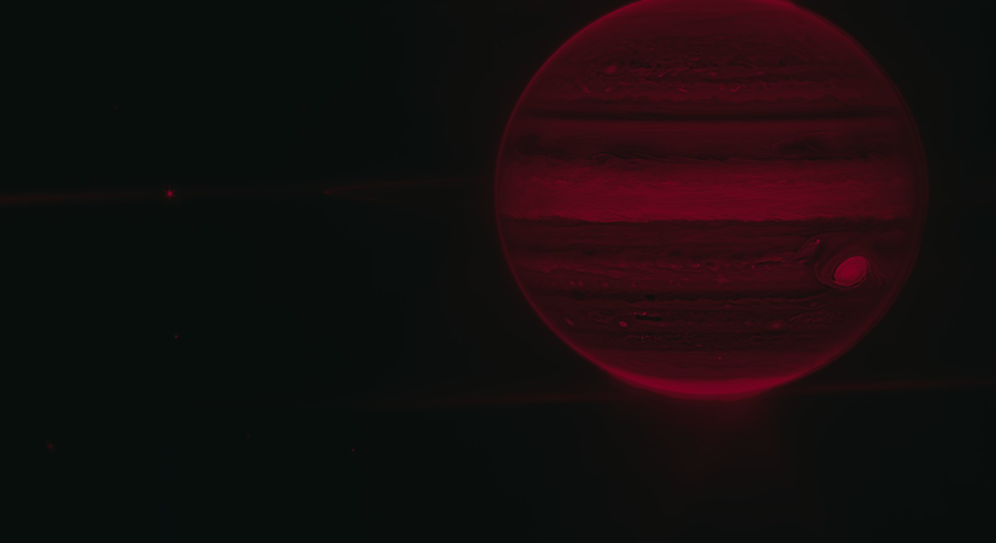 Webb NIRCam composite image from two filters – F212N (orange) and F335M (cyan) – of Jupiter system, ...