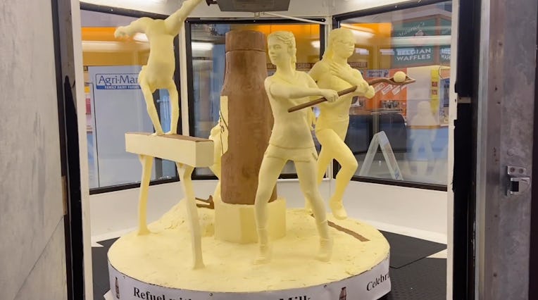 800-pound butter sculpture of four girl athletes, a lacrosse player, track star, skier and gymnast.