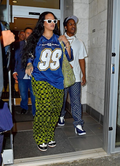 Rihanna's bare baby bump bursts out of tight jeans and crop top as